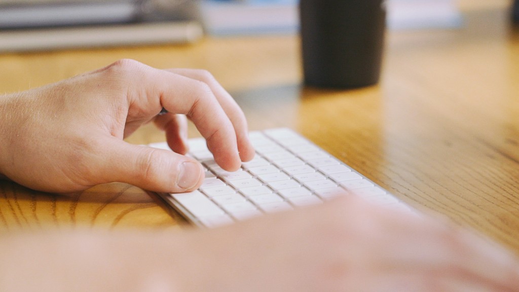 Hands typing on a keyboard